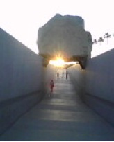 21’ tall granite quarry fragment in a permanent installation at the Los Angeles County Museum of Art. This is an April 20th sunset with near perfect sun- to- stone alignment.  Image courtesy of Stephen Knudsen.